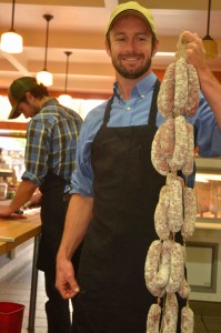 Aaron Gilliam with his sausages; Liam Watson in background