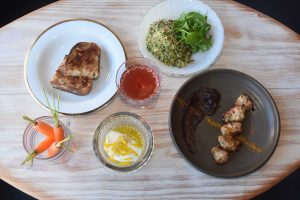 Flower + Bone – Hooch and an array of dishes pilaf pork yogurt and carrots