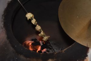 Flower + Bone – Pork on skewer over hot coals in clay oven